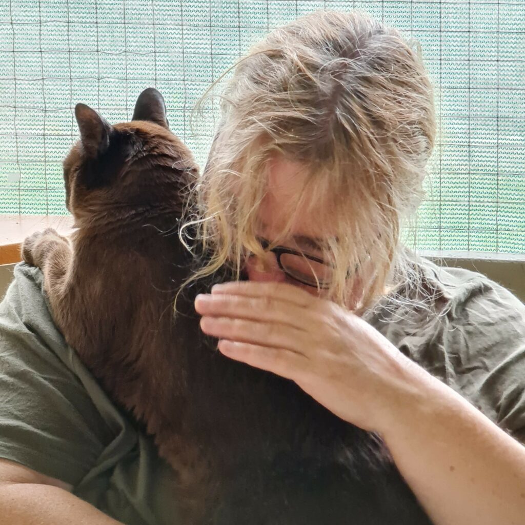 Carrie with a cat guest
